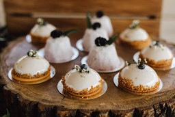 Photograph of a table with various desserts.